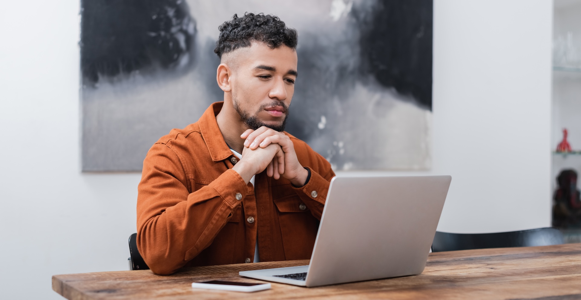 Freelancer sitting at desk thinking about marketing